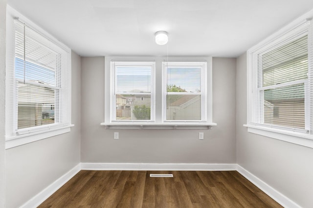 774 Congress St, Marion, OH 43302 - spare room featuring dark wood-style flooring, baseboards, and healthy amount of natural light