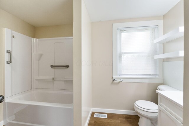 774 Congress St, Marion, OH 43302 - bathroom featuring toilet, baseboards, vanity, wood finished floors, and healthy amount of natural light