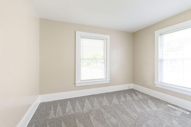 774 Congress St, Marion, OH 43302 - empty room with healthy amount of natural light, carpet flooring, and baseboards