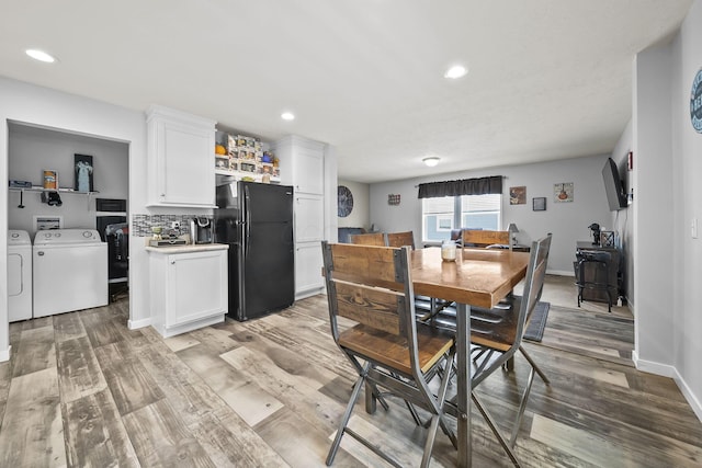 157 Joy Ave, Delaware, OH 43015 - dining room with washer and clothes dryer, light wood-style flooring, recessed lighting, and baseboards