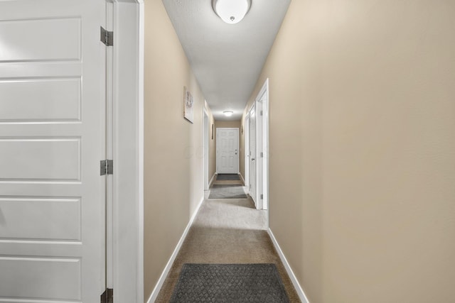 157 Joy Ave, Delaware, OH 43015 - hallway with baseboards and dark colored carpet