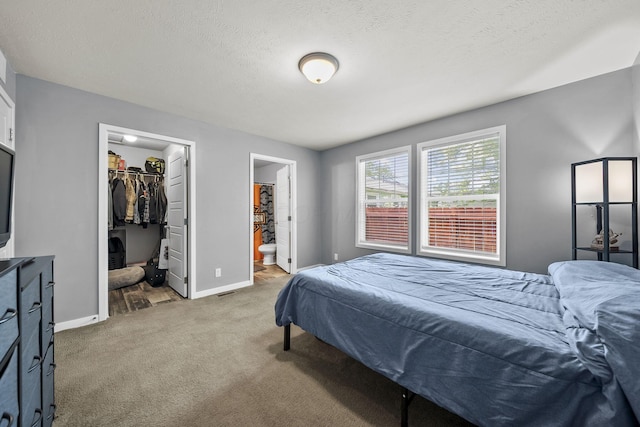 157 Joy Ave, Delaware, OH 43015 - bedroom featuring light colored carpet, a spacious closet, baseboards, a closet, and ensuite bath