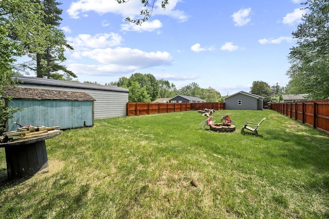157 Joy Ave, Delaware, OH 43015 - view of yard featuring an outdoor fire pit, an outdoor structure, and a storage shed