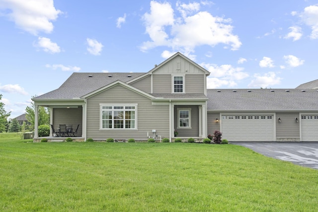 1070 Little Bear Pl, Lewis Center, OH 43035 - traditional home with driveway, a front yard, an attached garage, and board and batten siding