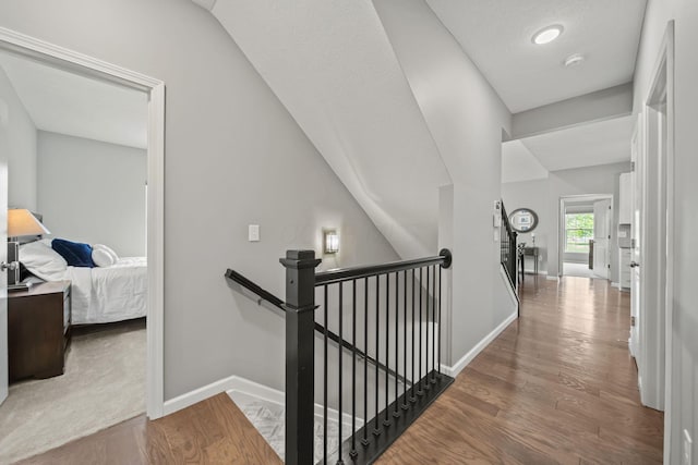 1070 Little Bear Pl, Lewis Center, OH 43035 - corridor featuring an upstairs landing, baseboards, and wood finished floors