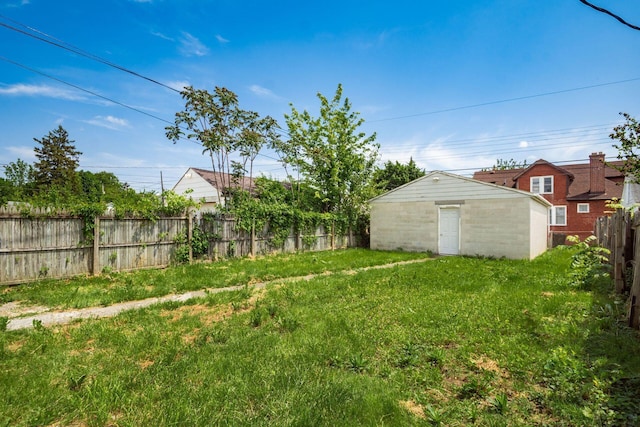 fenced backyard with an outbuilding