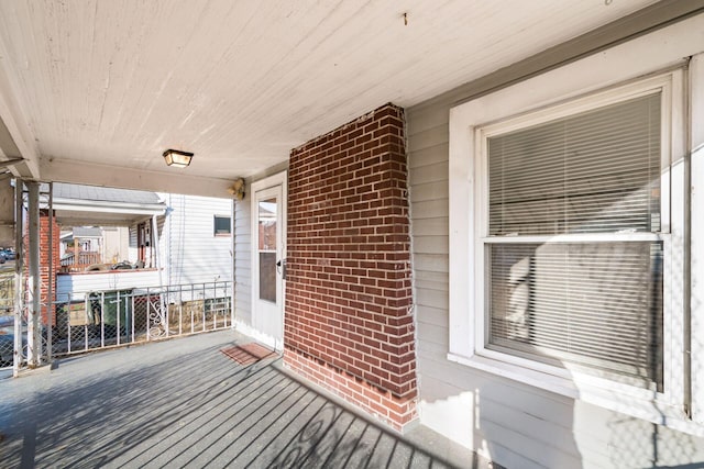 wooden deck featuring covered porch