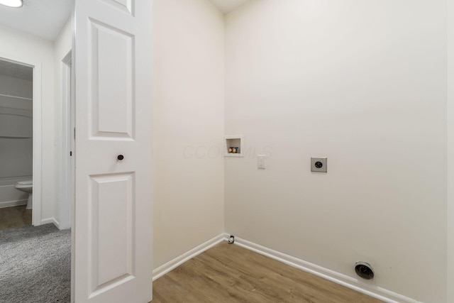 1993 Cumberland St, Newark, OH 43055 - washroom with hookup for an electric dryer, baseboards, washer hookup, light wood finished floors, and gas dryer hookup