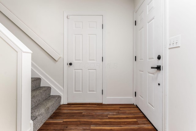 1810 Messner Dr Unit 62E, Hilliard, OH 43026 - foyer with dark wood-style floors, baseboards, and stairway