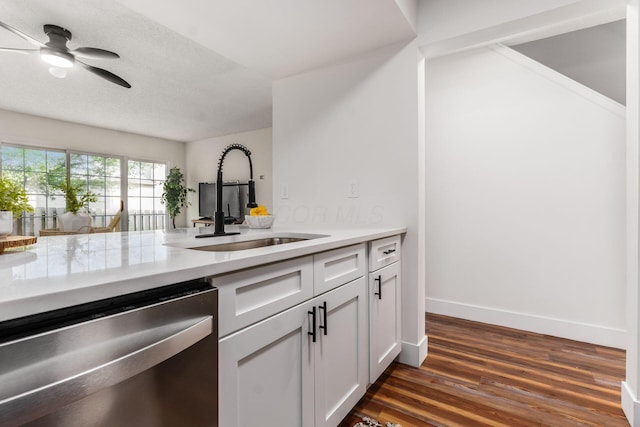 1810 Messner Dr Unit 62E, Hilliard, OH 43026 - kitchen with dishwasher, a sink, dark wood finished floors, ceiling fan, and light countertops