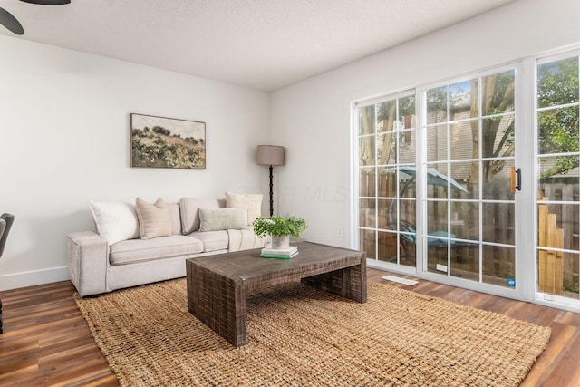 1810 Messner Dr Unit 62E, Hilliard, OH 43026 - living area with wood finished floors, baseboards, and ceiling fan