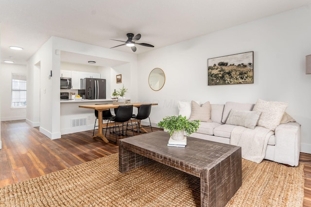 1810 Messner Dr Unit 62E, Hilliard, OH 43026 - living room with dark wood-style floors, a ceiling fan, and baseboards