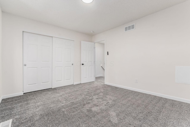 1810 Messner Dr Unit 62E, Hilliard, OH 43026 - unfurnished bedroom with carpet flooring, baseboards, and a closet
