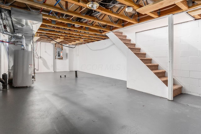 1810 Messner Dr Unit 62E, Hilliard, OH 43026 - unfinished basement featuring water heater, stairway, electric panel, and concrete block wall
