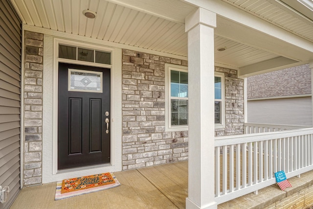 596 Courtright Dr E, Pickerington, OH 43147 - view of exterior entry with stone siding and a porch
