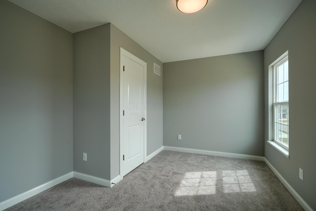 596 Courtright Dr E, Pickerington, OH 43147 - unfurnished bedroom featuring multiple windows and carpet flooring