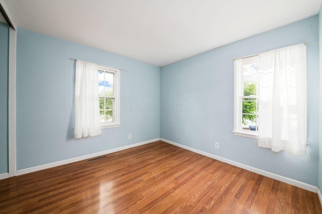 1512 Shanley Dr, Columbus, OH 43224 - empty room featuring wood finished floors and baseboards