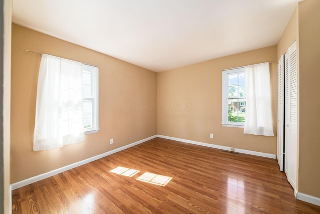 1512 Shanley Dr, Columbus, OH 43224 - unfurnished bedroom featuring baseboards and wood finished floors