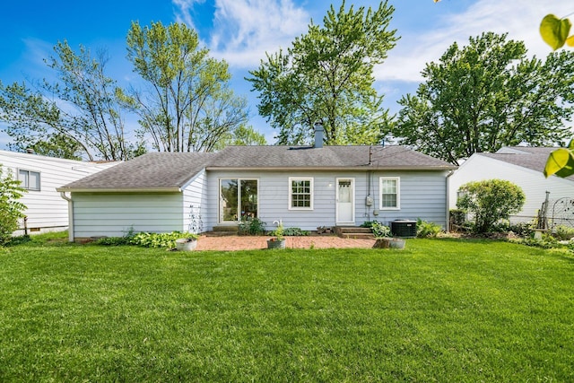 1512 Shanley Dr, Columbus, OH 43224 - back of house with central AC, a yard, and a chimney