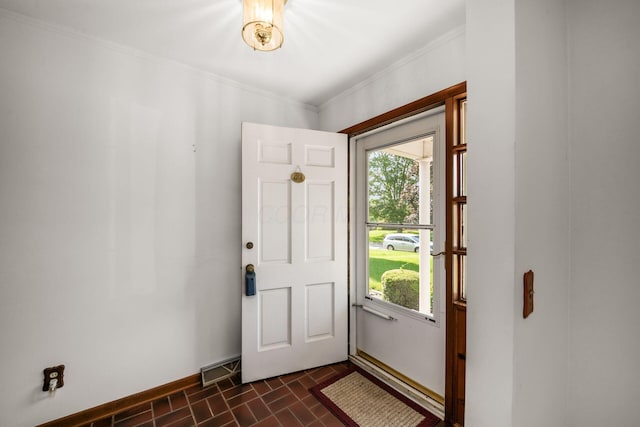 738 Stinson Dr, Columbus, OH 43214 - entryway featuring plenty of natural light, crown molding, and brick patterned flooring