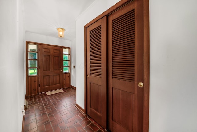 738 Stinson Dr, Columbus, OH 43214 - foyer entrance featuring brick patterned floors and baseboards