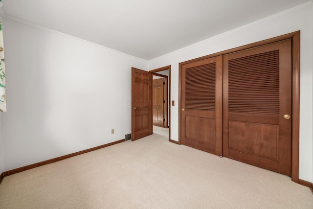 738 Stinson Dr, Columbus, OH 43214 - unfurnished bedroom with light carpet, ornamental molding, and a closet