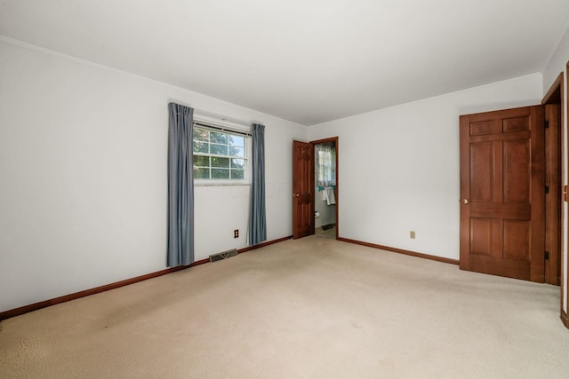 738 Stinson Dr, Columbus, OH 43214 - unfurnished bedroom featuring carpet and crown molding