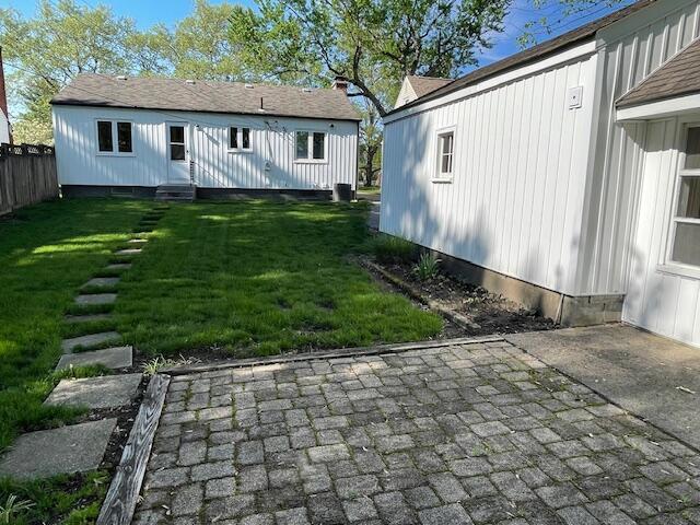 635 E Dominion Blvd, Columbus, OH 43214 - rear view of house with a patio and entry steps