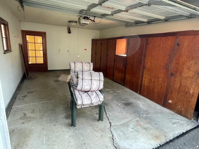 635 E Dominion Blvd, Columbus, OH 43214 - garage featuring a garage door opener and baseboards