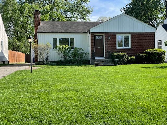 635 E Dominion Blvd, Columbus, OH 43214 - view of front of property with a chimney and brick siding