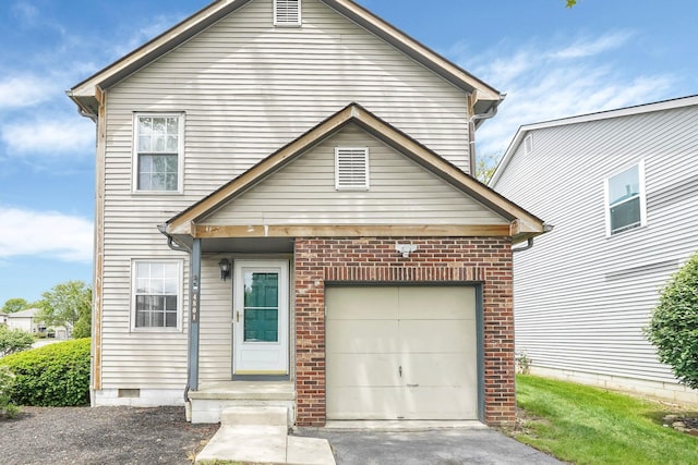 view of front facade with a garage and concrete driveway