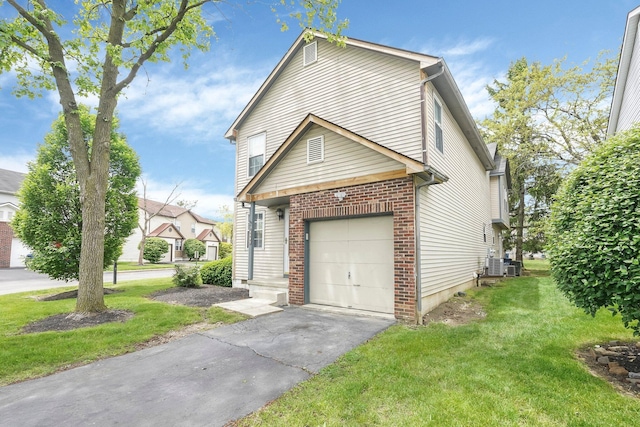 view of side of home with a yard, brick siding, central air condition unit, and asphalt driveway