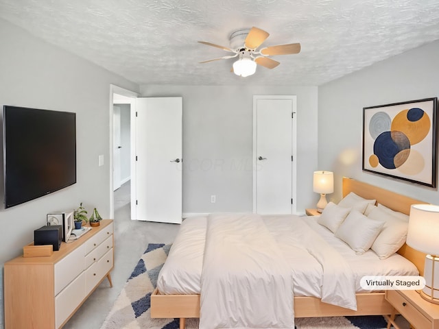 2620 Trailwind St, Grove City, OH 43123 - bedroom featuring ceiling fan, a textured ceiling, and light colored carpet