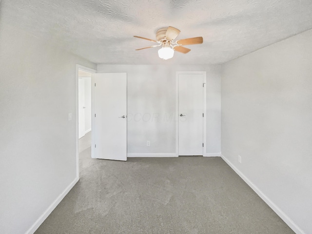2620 Trailwind St, Grove City, OH 43123 - unfurnished bedroom with carpet, baseboards, ceiling fan, and a textured ceiling