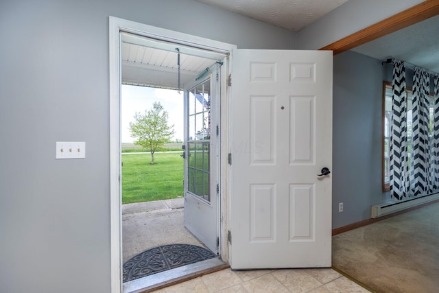 13216 Sheley Road Nw, Jeffersonville, OH 43128 - entryway with baseboard heating, baseboards, and light colored carpet
