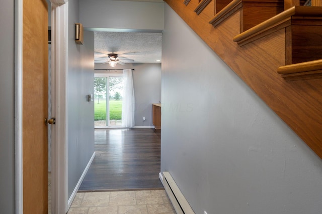 13216 Sheley Road Nw, Jeffersonville, OH 43128 - hall with baseboards, light stone finish floors, and a textured ceiling