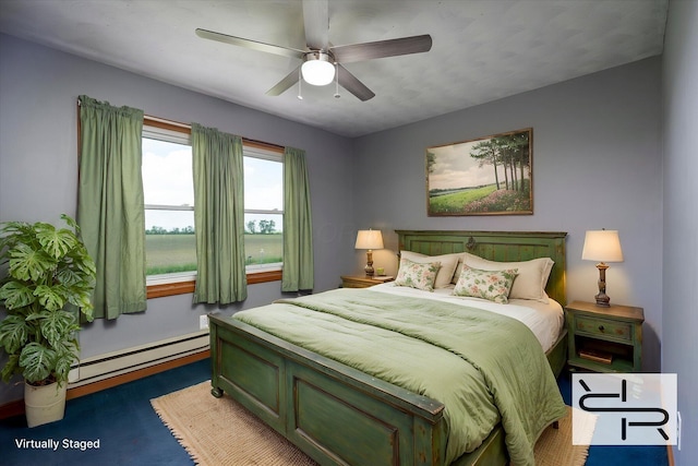 13216 Sheley Road Nw, Jeffersonville, OH 43128 - bedroom featuring baseboard heating and a ceiling fan
