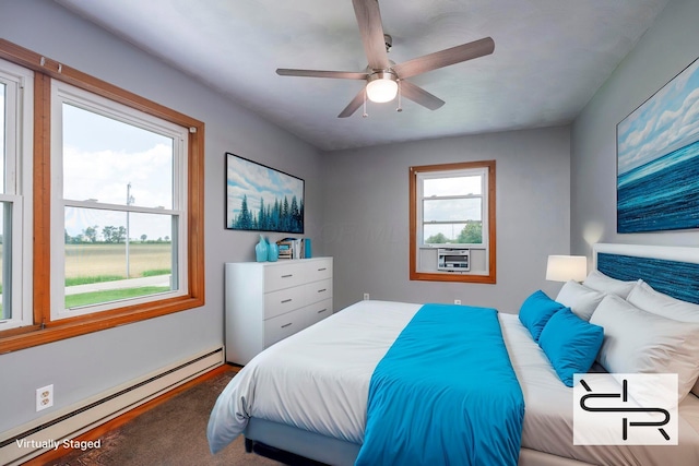 13216 Sheley Road Nw, Jeffersonville, OH 43128 - bedroom with a baseboard heating unit and ceiling fan