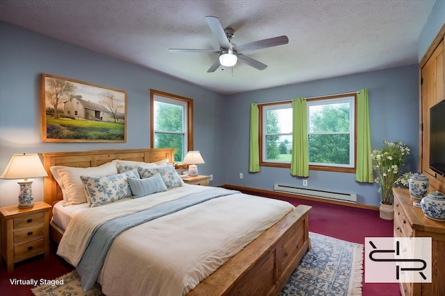 13216 Sheley Road Nw, Jeffersonville, OH 43128 - bedroom featuring baseboard heating, multiple windows, baseboards, a textured ceiling, and a ceiling fan
