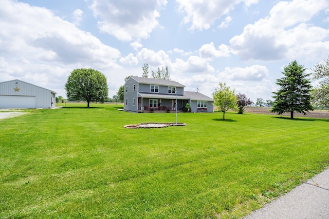 13216 Sheley Road Nw, Jeffersonville, OH 43128 - view of green lawn featuring an outdoor structure and a detached garage