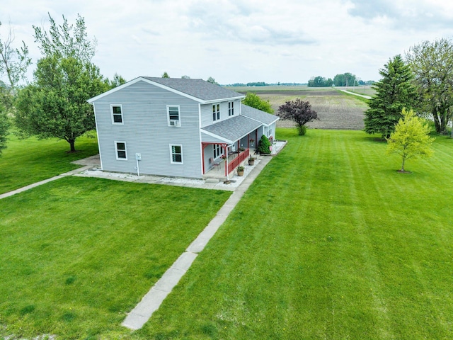 13216 Sheley Road Nw, Jeffersonville, OH 43128 - rear view of property with covered porch, a lawn, and roof with shingles