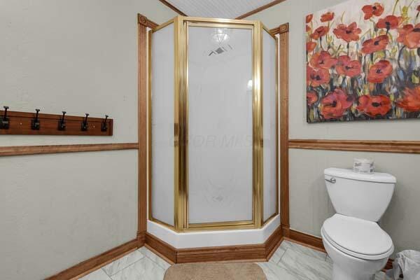 29002 Rockstull Rd, Sugar Grove, OH 43155 - full bath with a stall shower, toilet, and baseboards