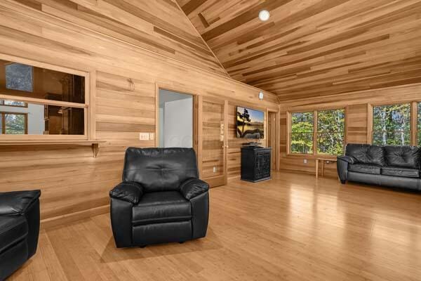 29002 Rockstull Rd, Sugar Grove, OH 43155 - sitting room with wood walls, wood ceiling, wood finished floors, vaulted ceiling, and a fireplace