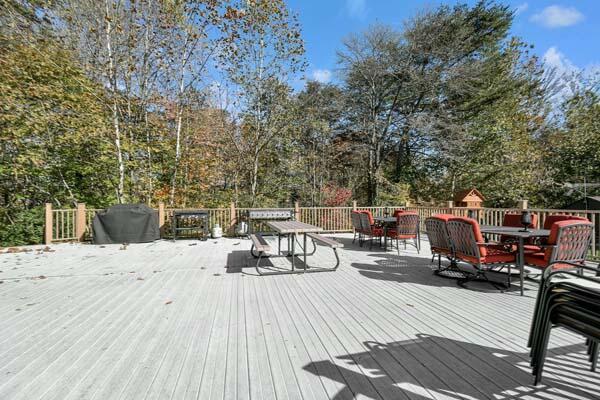 29002 Rockstull Rd, Sugar Grove, OH 43155 - wooden terrace with outdoor dining area and view of wooded area
