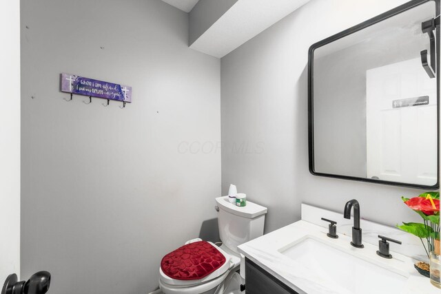 7936 Slate Ridge Blvd, Reynoldsburg, OH 43068 - bathroom featuring toilet and vanity
