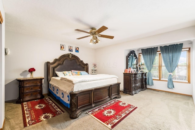 7936 Slate Ridge Blvd, Reynoldsburg, OH 43068 - bedroom with light carpet, baseboards, and a ceiling fan