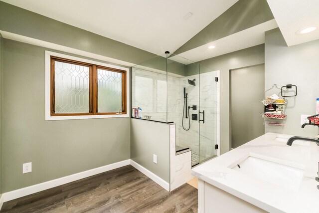 7936 Slate Ridge Blvd, Reynoldsburg, OH 43068 - full bathroom featuring a shower stall, wood finished floors, baseboards, recessed lighting, and double vanity
