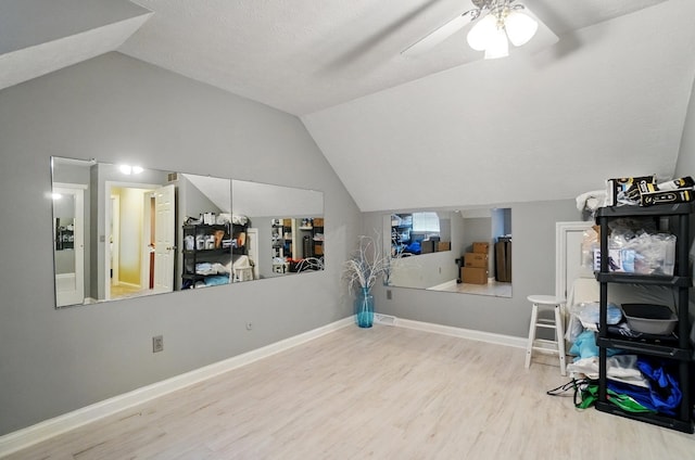 5336 Rocky Creek Dr, Grove City, OH 43123 - recreation room with vaulted ceiling, wood finished floors, a ceiling fan, and baseboards