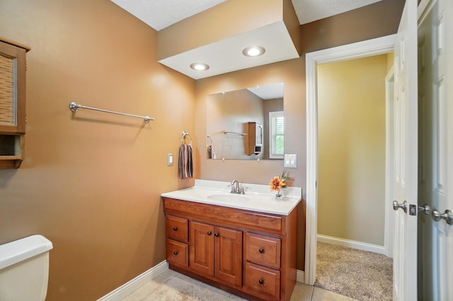 5336 Rocky Creek Dr, Grove City, OH 43123 - bathroom with baseboards, toilet, vanity, and tile patterned floors