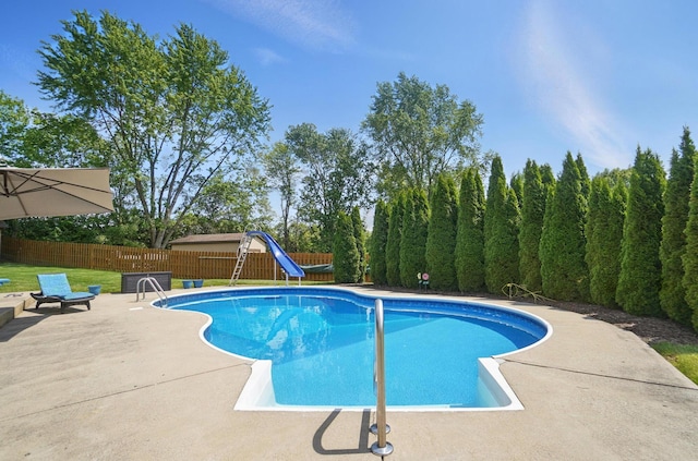 5336 Rocky Creek Dr, Grove City, OH 43123 - view of swimming pool with a water slide, a fenced backyard, and a patio